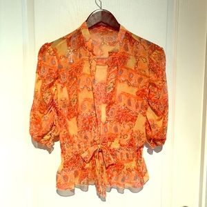 Sheer orange shirt with paisley design